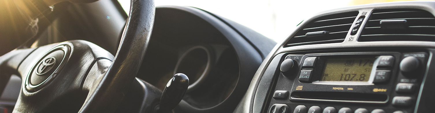 interior of a vehicle focusing on the steering wheel and radio